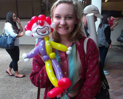 Girl holdind a balloon clown